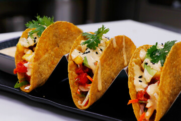 traditional Mexican dish taco,consisting of a small hand-sized corn or wheat tortilla topped with a filling