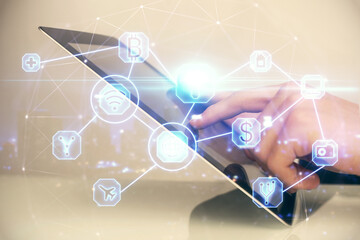 Double exposure of man's hands holding and using a phone and social network theme drawing.