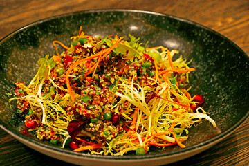 quinoa salad with bell peppers, avocado, beans and carrots