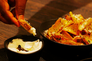 crispy fried potato chips or wedges with truffle cream dip