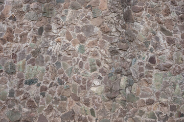 Decorative stone wall in various shades and sober colors, for background use.