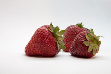 
ripe juicy strawberries closeup isolated on white background