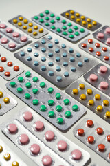 Advanced Healthcare. Composition with many medical pills, tablets pack in blister lying diagonally over white background. Health care, vitamins and treatment concept