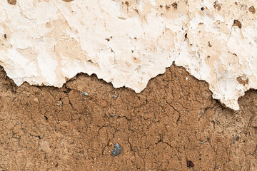 Old house wall falling apart texture background orange brown yellow white grunge space for text