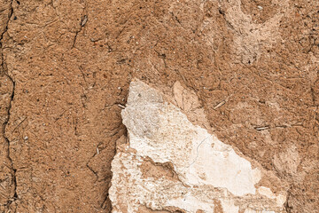 Old house wall falling apart texture background orange brown yellow white grunge space for text