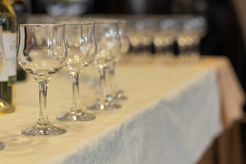 banquet hall table dinner time empty glasses for wine soft focus objects twilight romantic lighting