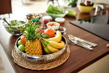 Fruit platter. Tropical fruits on a wooden table desk. Healthy vegetarian food concept.