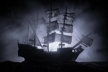 Wall murals Schip Black silhouette of the pirate ship in night