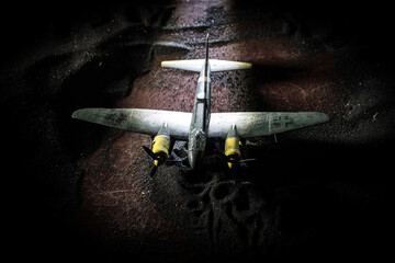 German Junker (Ju-88) night bomber at night. Artwork decoration with scale model of jet-propelled...