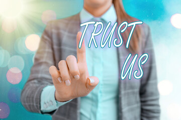 Handwriting text writing Trust Us. Conceptual photo believing in the integrity and honesty of a...