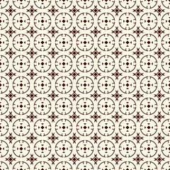 Ethnic, tribal wallpaper. Repeated segmented circles seamless pattern. Openwork ornament. Delicate ornamental background