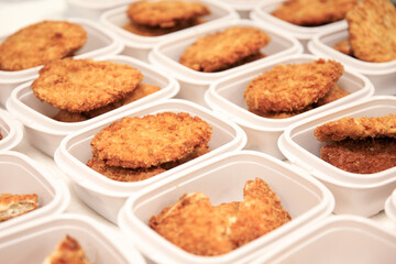 A picture of a lunch box served in a pork cutlet bowl.