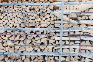 Firewood is lying. Firewood background. Firewood close-up. Wood. Fuel. Burn wood. Birch wood. Use the stove. Stacked. Chop wood