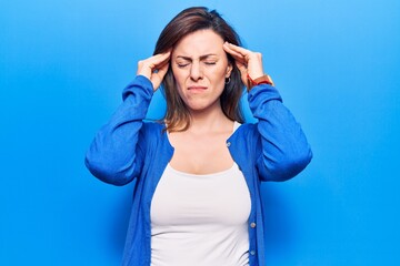 Young beautiful woman wearing casual clothes suffering from headache desperate and stressed because pain and migraine. hands on head.