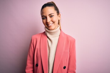Young beautiful blonde businesswoman with blue eyes wearing elegant pink jacket with a happy and cool smile on face. Lucky person.