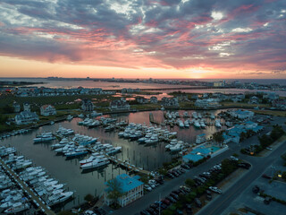 Aerial view of a dramatic sunrise over a marina in Ocean City, Maryland.
