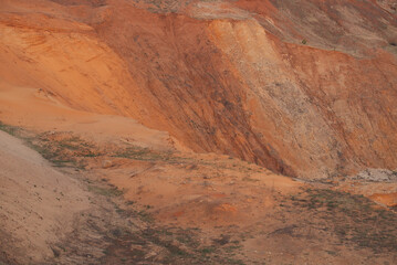 Red clay quarry. Clay quarry. Top view of a sand excavation site. Earth rocks are digging for building materials. Beautiful natural landscape to the land. Quarry with sand, sand loading, ground water,
