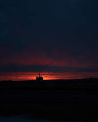 barn silo at sunset