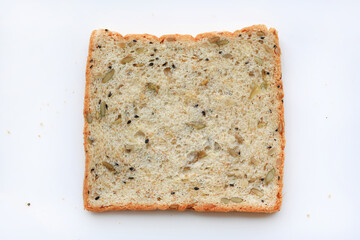 Sliced whole grain bread with seeds isolated on white background. Top view.