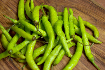 Fresh Green Chilies on Wooden Background top View Close-Up Stock Photograph Image