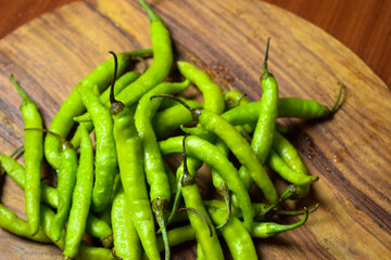 Fresh Green Chilies on Wooden Background top View Close-Up Stock Photograph Image