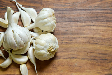 Garlic and Garlic Cloves on a Vintage Wooden Background