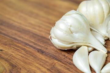 Garlic and Garlic Cloves on a Vintage Wooden Background