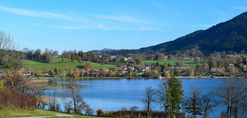 Clear blue sky day views of the Tegernsee lake blue water next to suouth Germany bavarian villages at the Alps montains