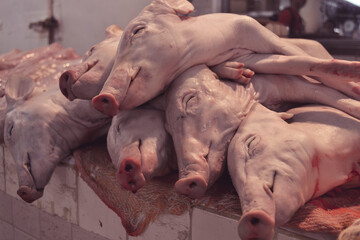 death pigs on the market. Animal cruelty concept