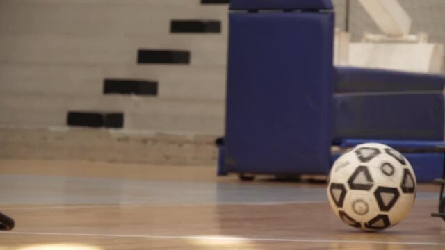 motorized wheelchair paralympic power soccer players playing slow motion