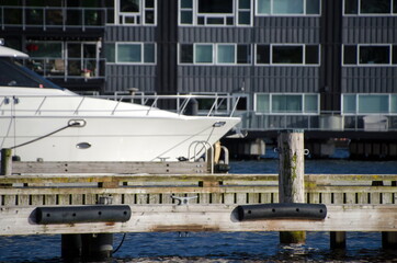 Yacht between pier and apartments  near city dock in Kirkland