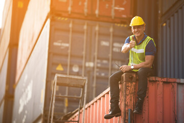 Portrait of a foreman or engineer working in an international shipping area, concept of business...
