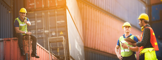 Portrait of a foreman or engineer working in an international shipping area, concept of business...