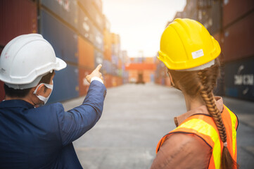 worker teamwork and partner of foreman, engineer, and businessman working in an international shipping area, concept of business industrial and working in container yard