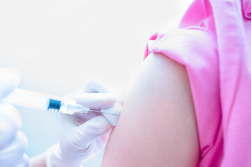 Injection vaccination upper shoulder. Close-up hand's doctor or nurses are vaccination to patient...
