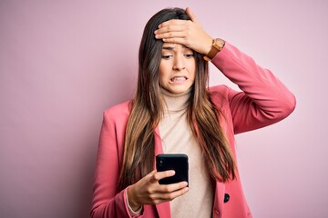 Young beautiful girl having conversation using smartphone over white background stressed with hand on head, shocked with shame and surprise face, angry and frustrated. Fear and upset for mistake.