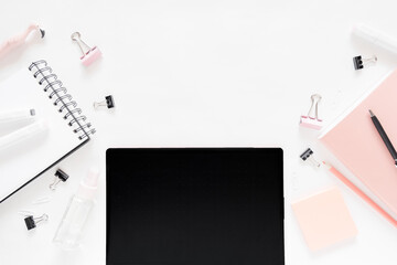 Top view of workplace with graphic tablet  on workspace desk with stationery and notepads. Top horizontal view