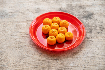 mandarin oranges on a red tray
