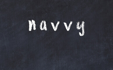 College chalk desk with the word navvy written on in