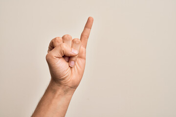 Hand of caucasian young man showing fingers over isolated white background showing little finger as pinky promise commitment, number one