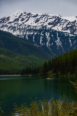Fototapeta na wymiar Kayaker on Stanton Lake and Great Northern Mountain, Montana