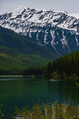 Fototapeta premium Kayaker on Stanton Lake and Great Northern Mountain, Montana