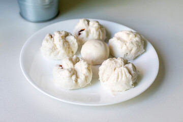 Chinese buns on a white plate