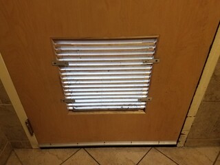 vent on bathroom door with covering