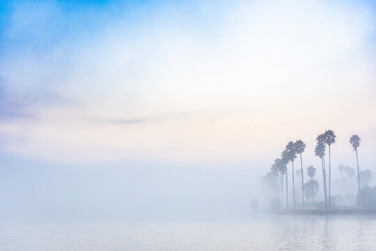 Foggy cloudy good morning sunrise on the water in San Diego, California