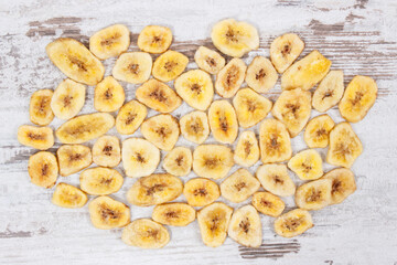 Homemade dried chips of banana for snack or dessert