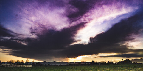 Purple sunset with amazing clouds © Eduardo