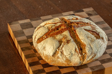 Sour dough bread on a checkerboard cutting board landscape