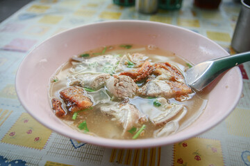 Paste of rice flour with pork or boiled Chinese pasta square with pork in chinatown Bangkok Thailand