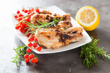 chicken legs a grill with seasonings on a table, selective focus